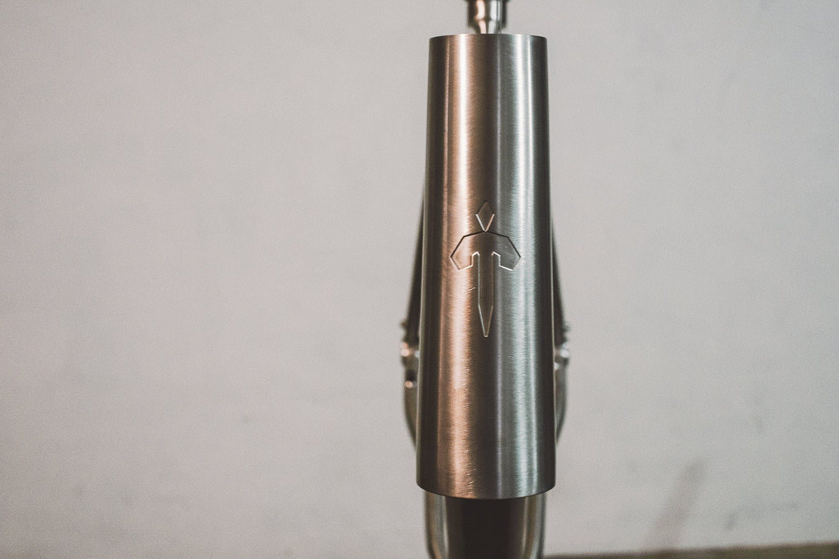 Close-up detail of a Tizona titanium bike frame