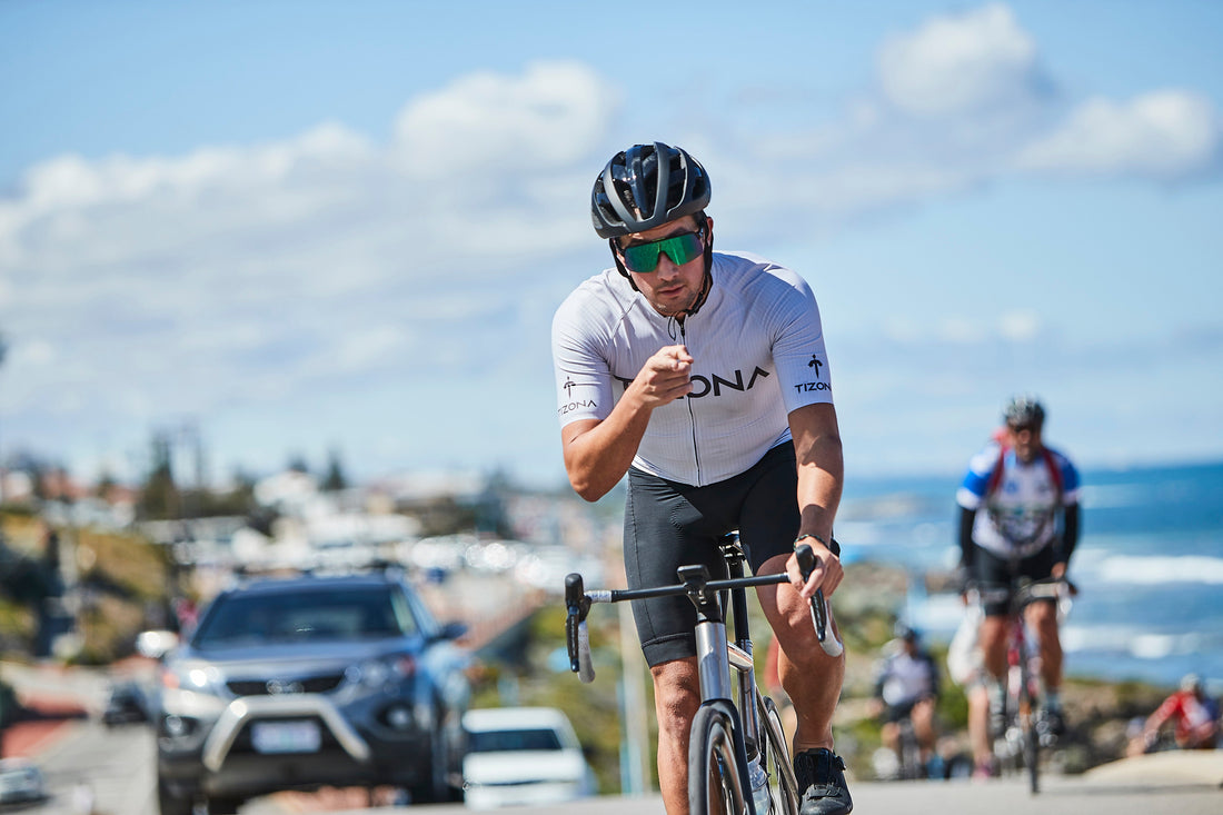 Cyclist riding a titanium bike along the Fremantle coast, Western Australia